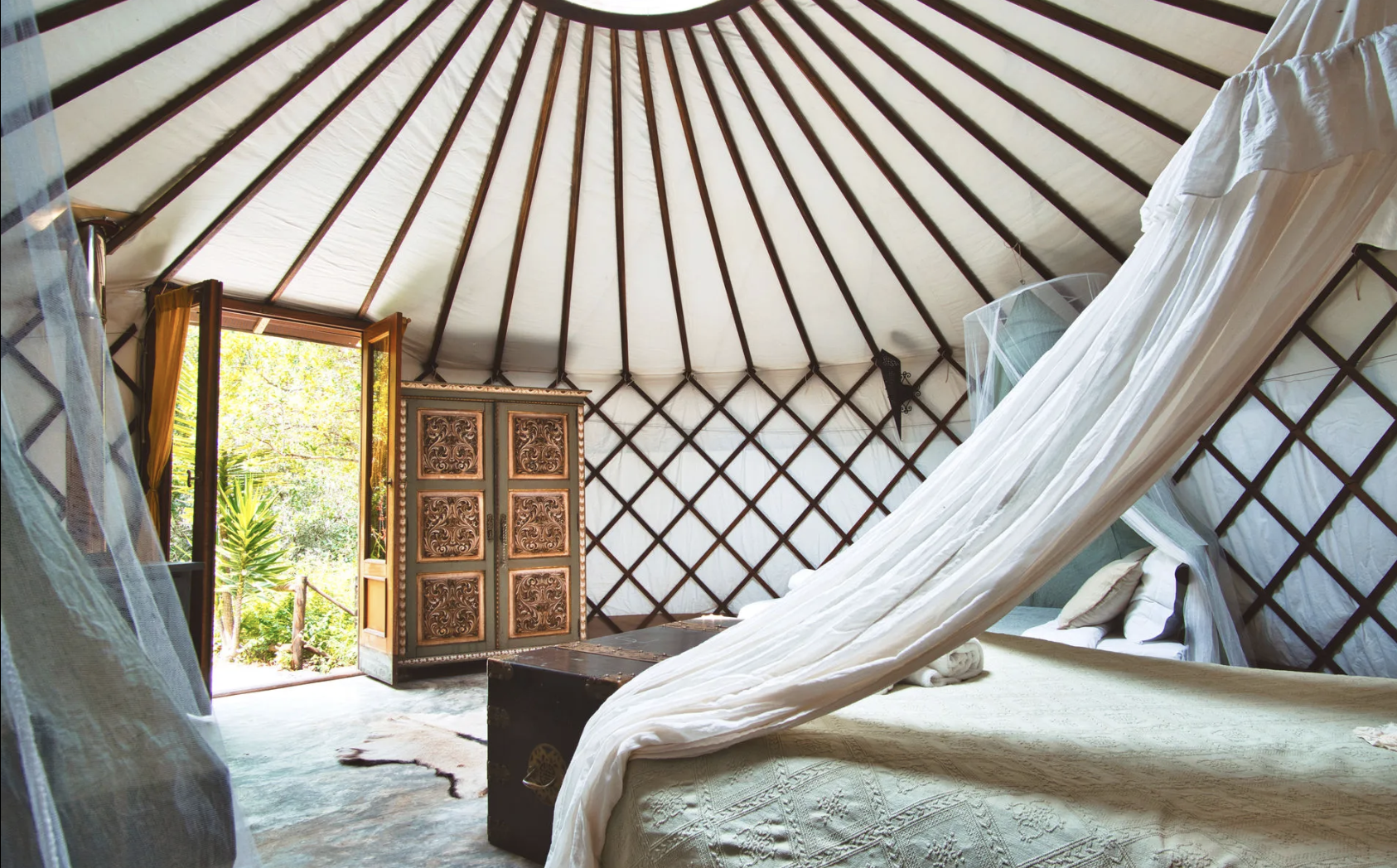 Aterra yurt interior with carved door