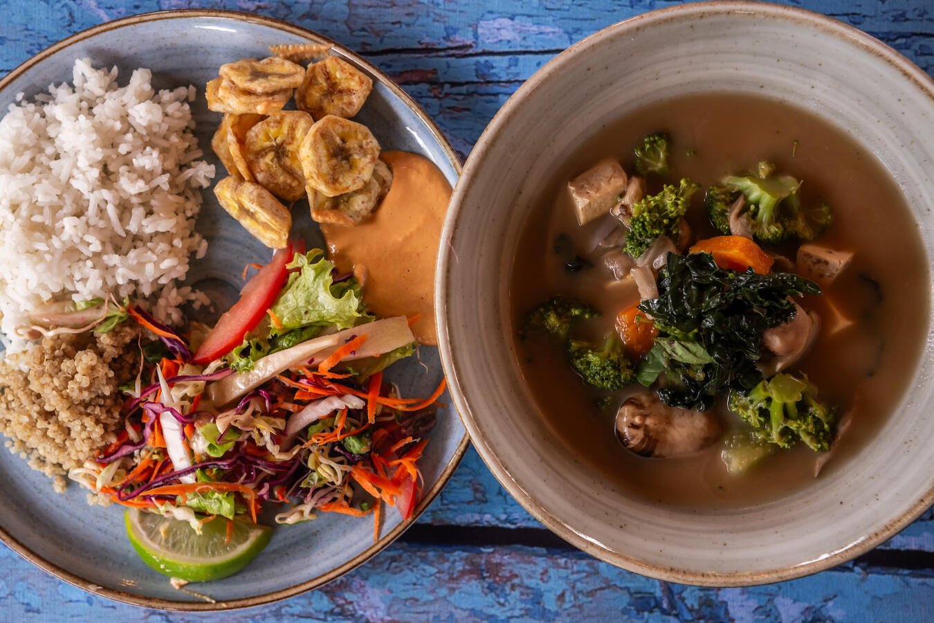 Plate of rice, plantains, salad and soup at Casa Sumapaz