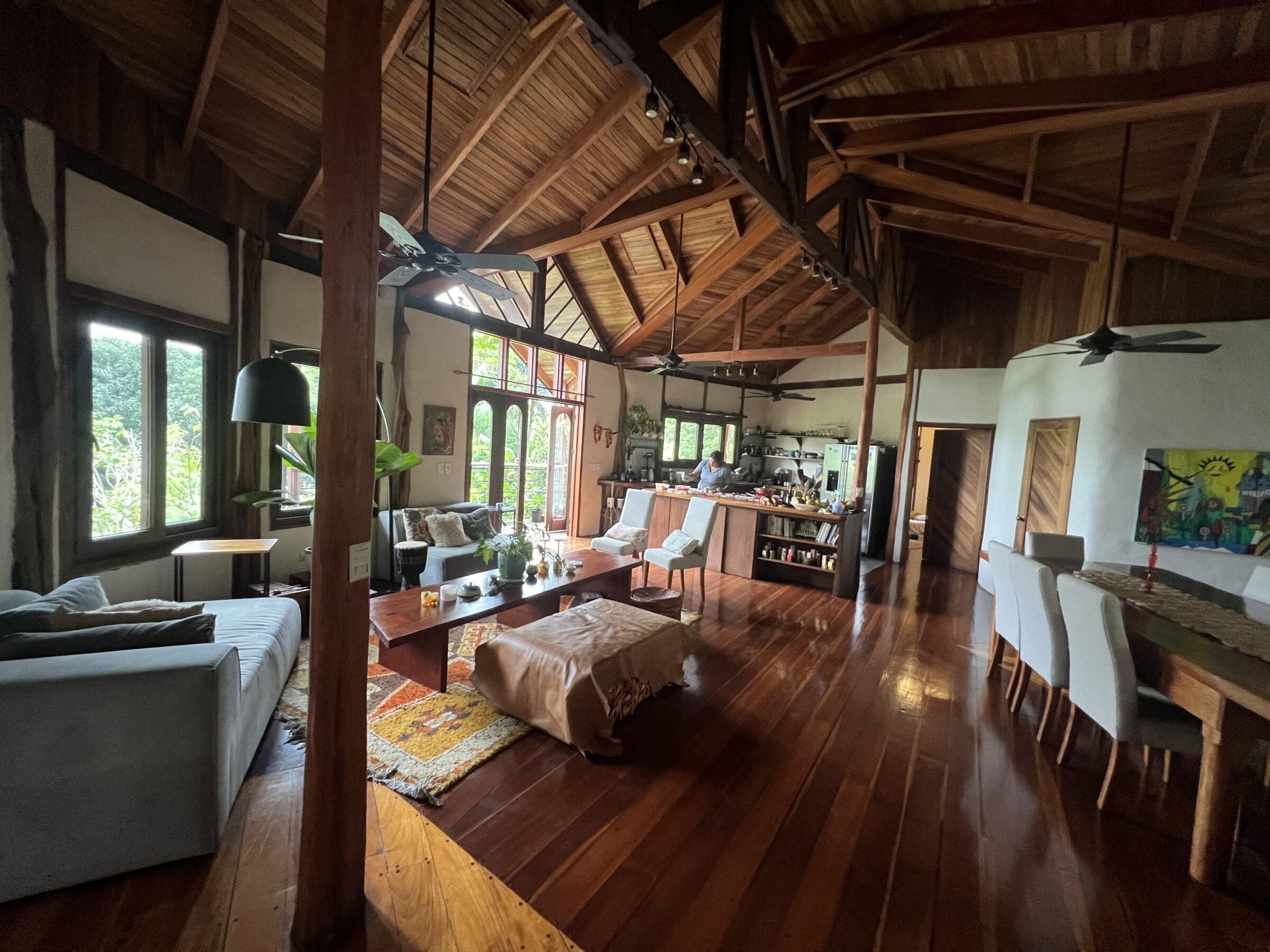 Casa Brisa open-plan living and dining space with high wood ceilings